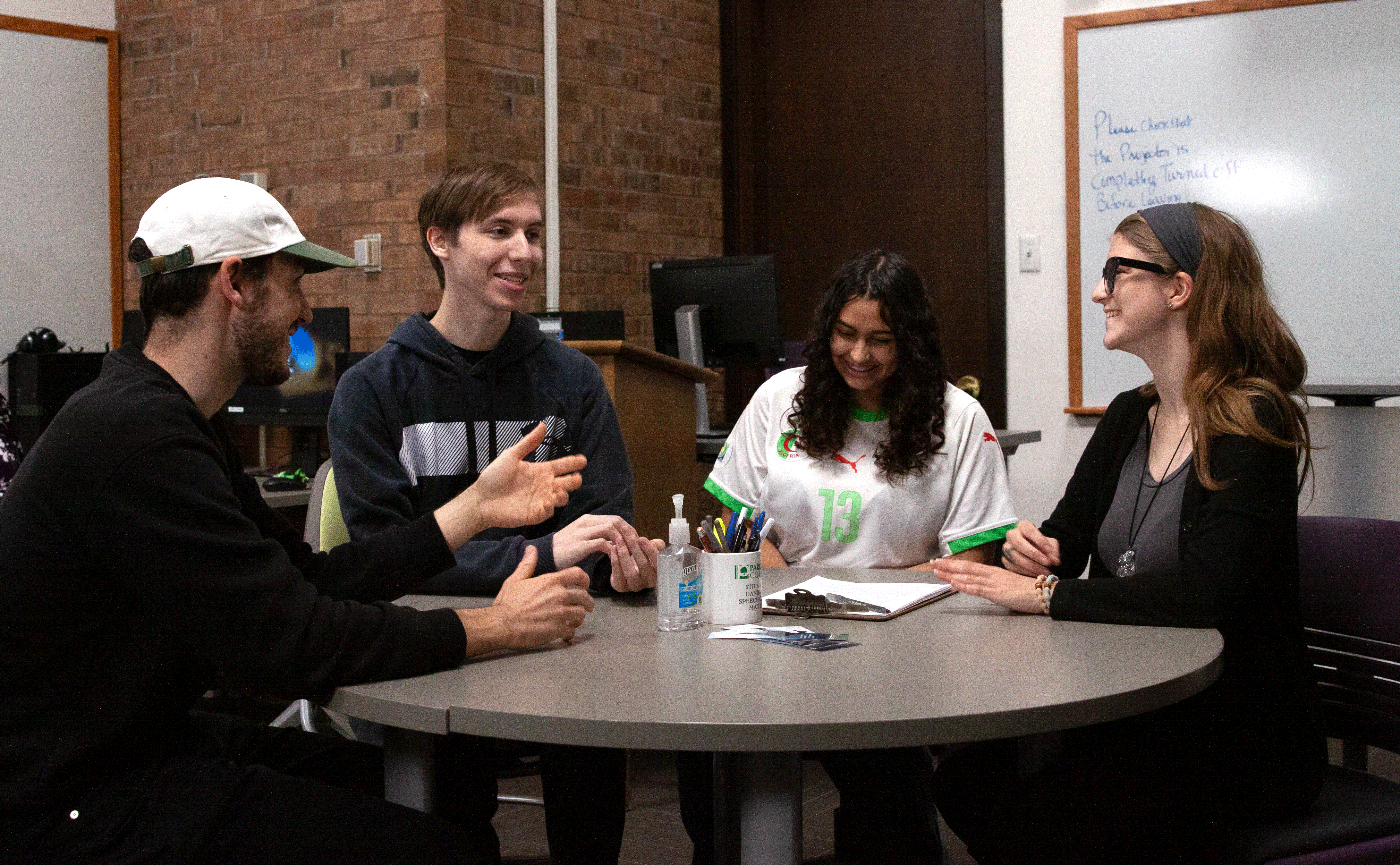 Students conversing at a table